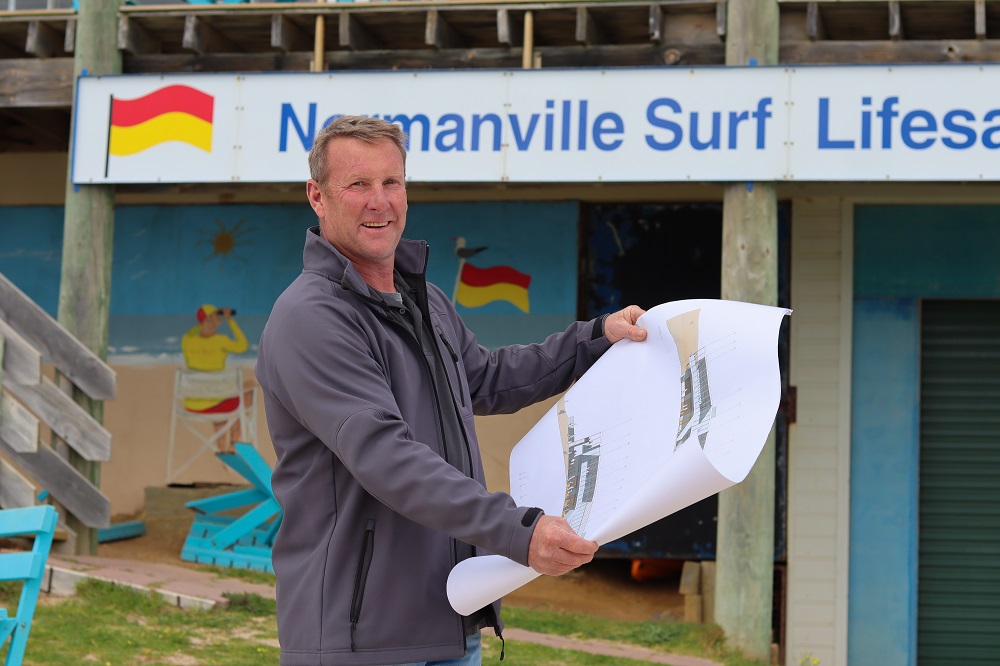 President of Normanville SLSC hold the new plans