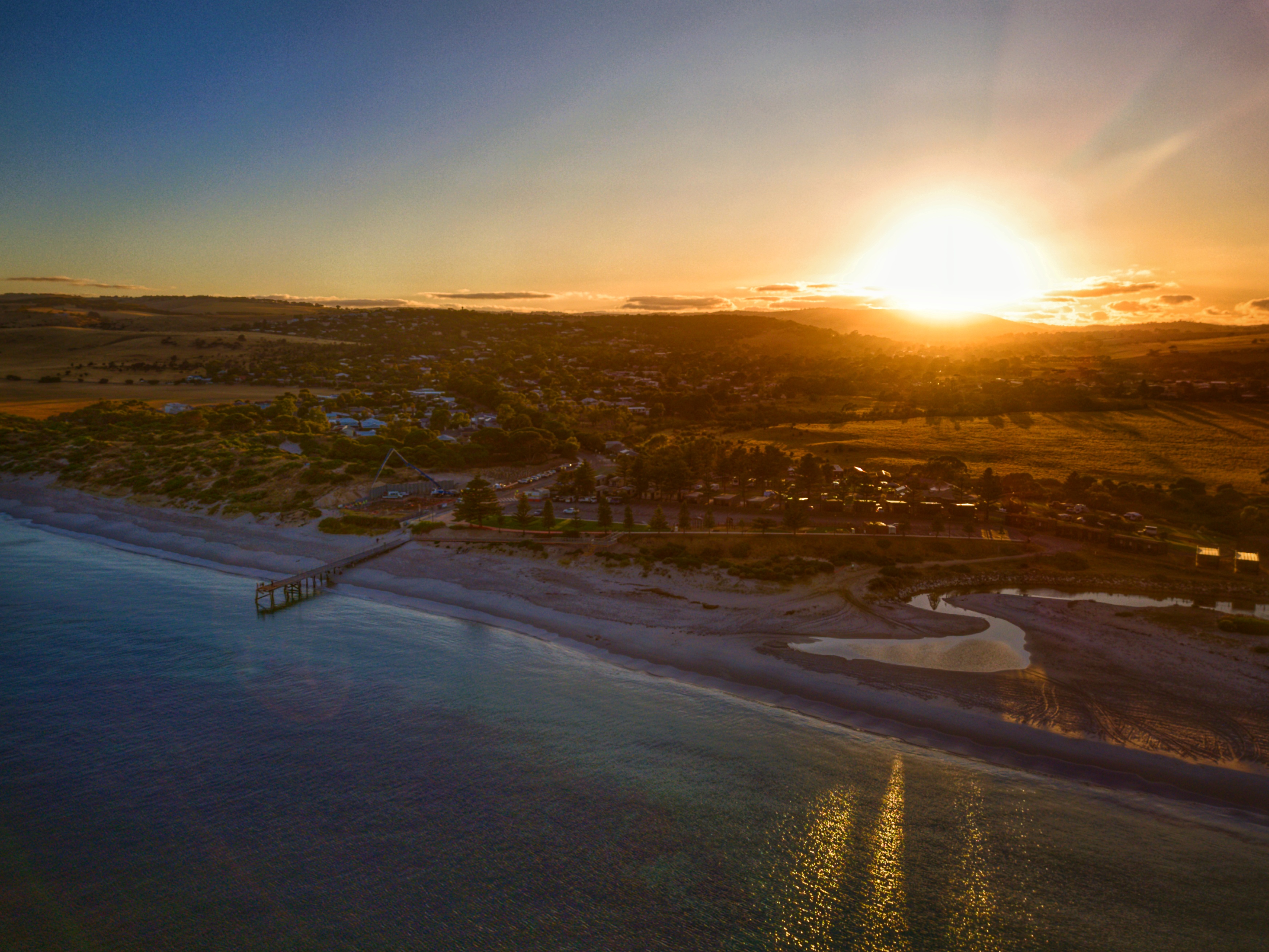 An overhead photo of the Normanville Foreshore during the pouring on the Normanville Surf Life Saving Club slab pour. The sun is rising in the background.