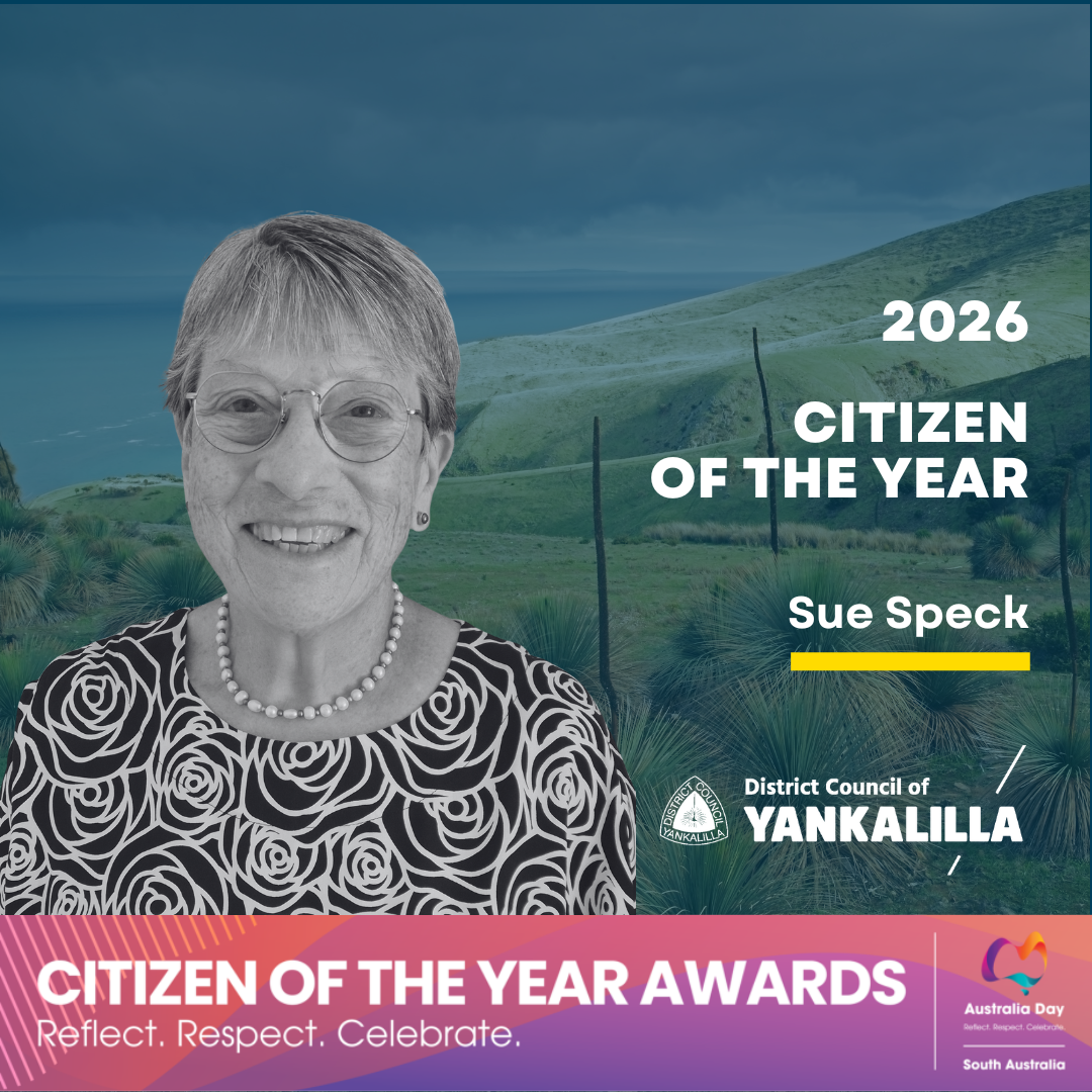 Photograph announcing Sue Speck as 2026 Citizen of the Year by District Council of Yankalilla, featuring a blurred portrait against a green landscape background. Text includes award title, recipient name with a yellow underline, council logo, and a pink banner at bottom promoting Citizen of the Year Awards with tagline "Reflect. Respect. Celebrate." and Australia Day South Australia branding.