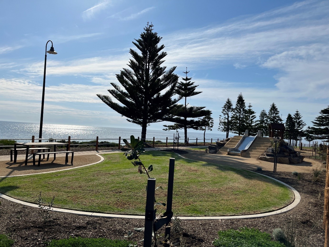 A photo of the lawn area and slippery dip at the Normanville Foreshore