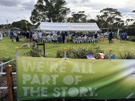 A marquee in the background with an Australia Day banner in the foreground
