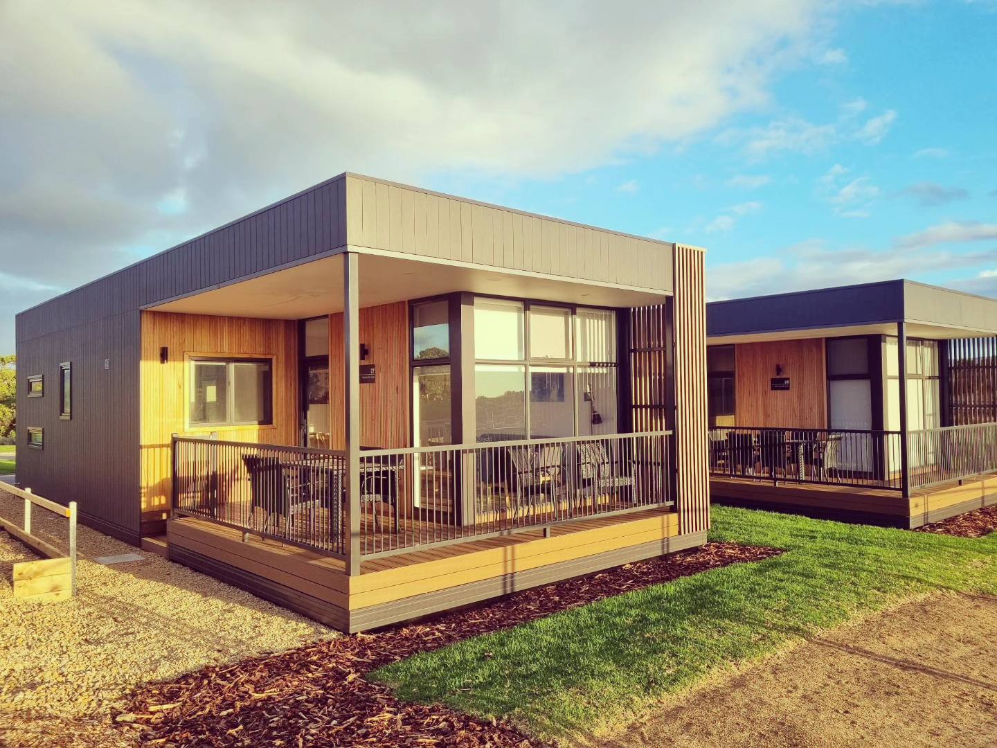 A photo of a cabin at the BIG4 Normanville Holiday Park. The photo is taken outside, facing the front of the cabin.