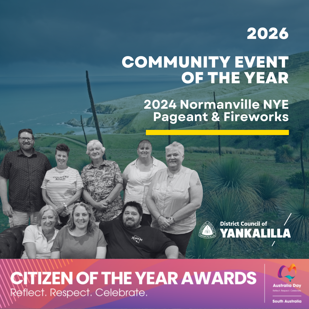 Photograph promoting the 2026 Community Event of the Year featuring a group of 8 people standing and sitting outdoors with a scenic coastal background. Text highlights the 2024 Normanville NYE Pageant & Fireworks, District Council of Yankalilla logo, and Citizen of the Year Awards with a colorful banner emphasizing reflection, respect, and celebration.